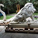 Lion and snake statues on skids